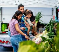 Family shopping at a farmers market Food is medicine Produce prescription